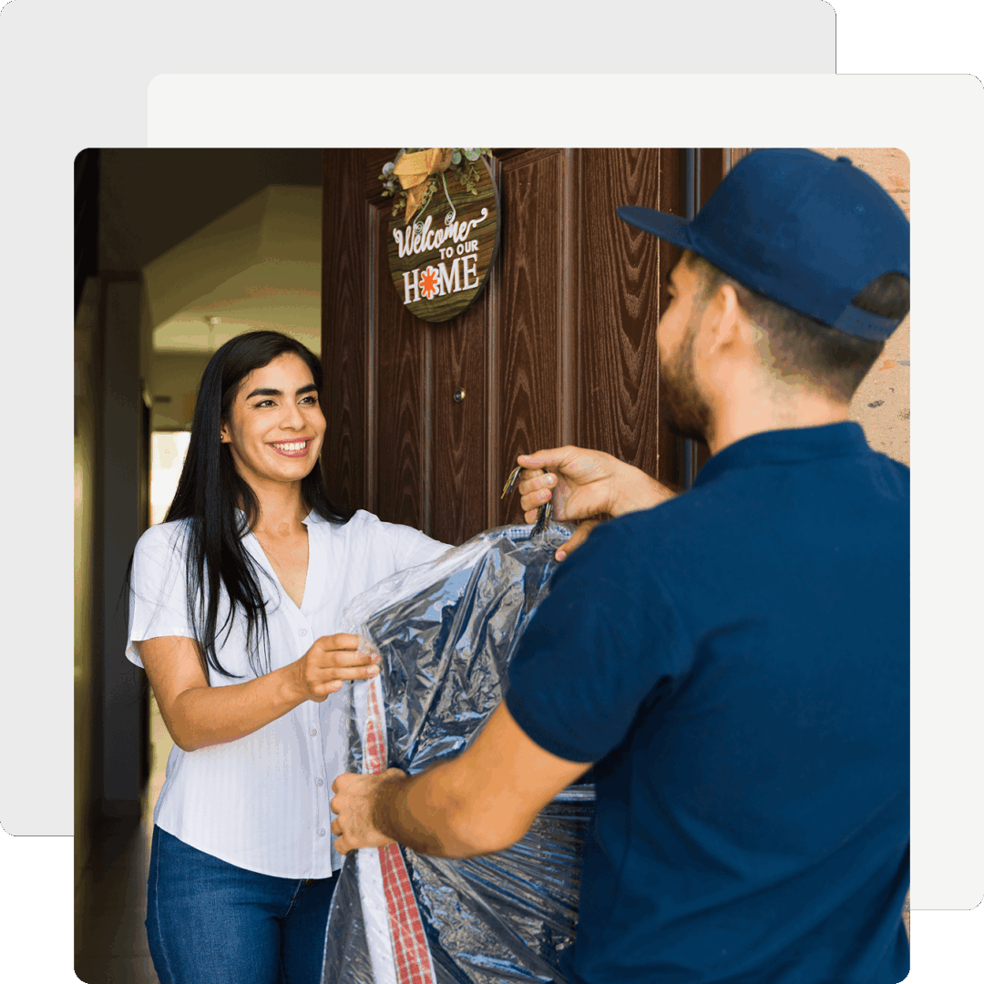 Woman receiving package from delivery person.